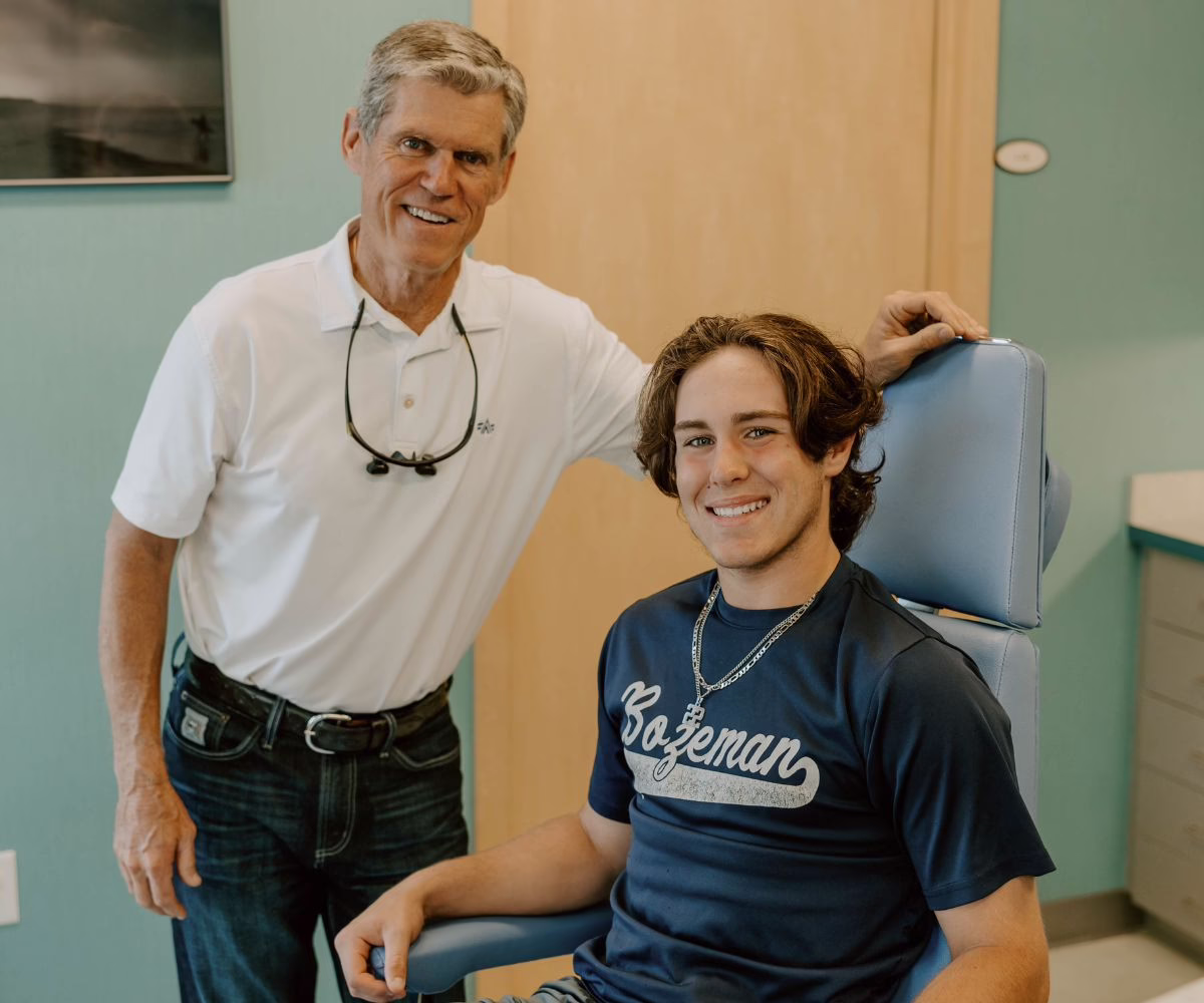 Dr. Buttram and teen patient in exam chair, smiling, Panama City orthodontics