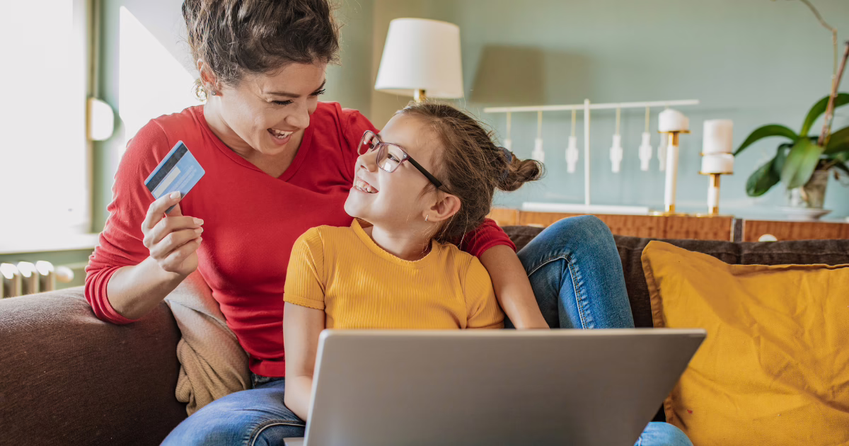 Mom and daughter using credit card, online, using FSA for braces or Invisalign with Buttram Orthodontics, Panama City FL