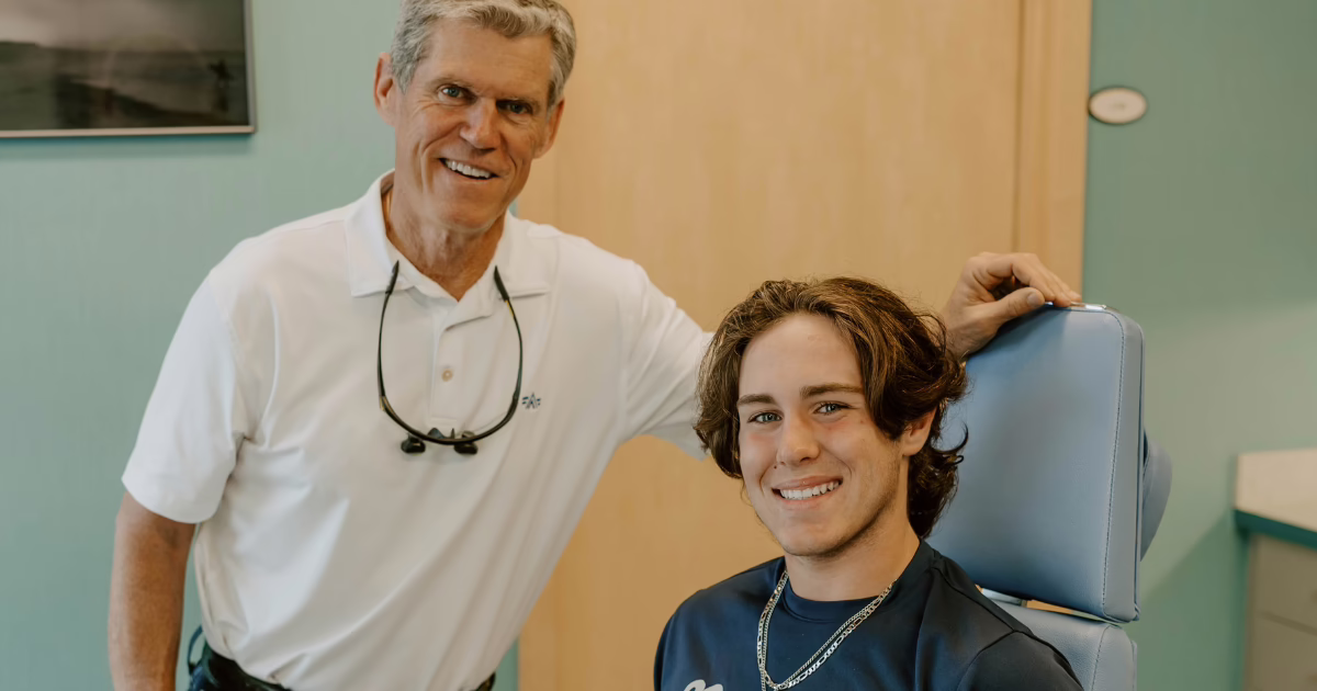 Dr. Buttram, Panama City orthodontist, with patient smiling in exam chair, How to Clean Invisalign 101